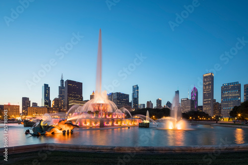 USA, Illinois, Chicago, Skyline, Millennium Park with Buckingham Fountain at blue hour photo