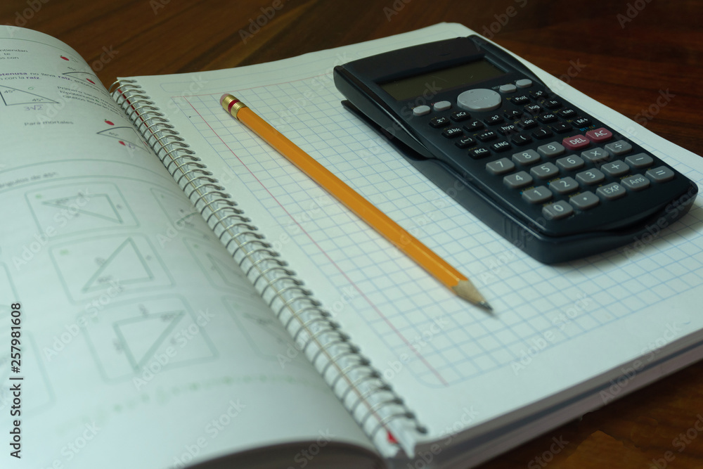 Calculator, notebook and pen. Calculator, notebook and pen.