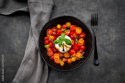 Bowl of tomato salad with burrata