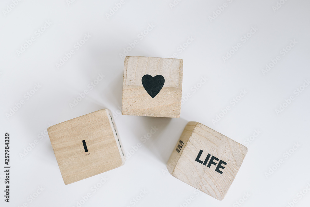 Wooden cubes or dice with a message saying Wooden cubes or dice with a message saying