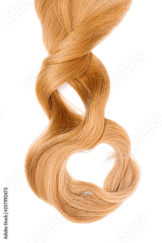 Blond hair in shape of heart, isolated on white background