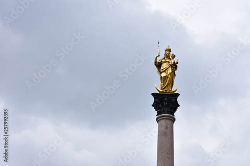 Golden statue on a column at the Marienplatz