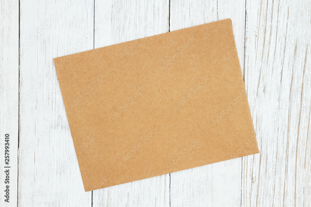 Blank greeting card on weathered whitewash textured wood background Blank greeting card on weathered whitewash textured wood background