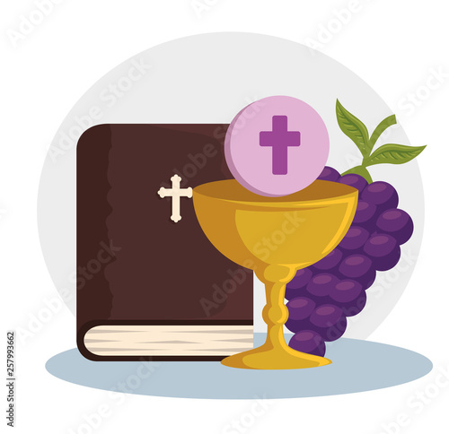 catholic bible and chalice with holy host to event