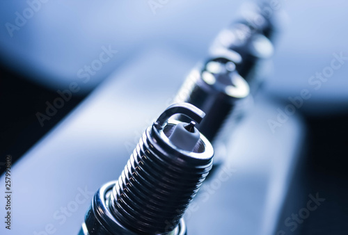 Spark plugs for car, on light background photo