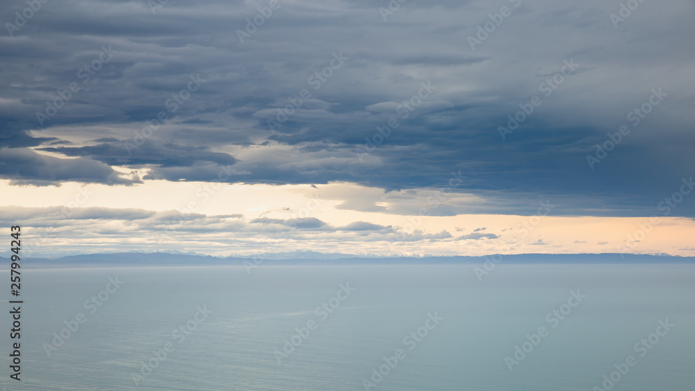 sea ocean and dark blue sky clouds