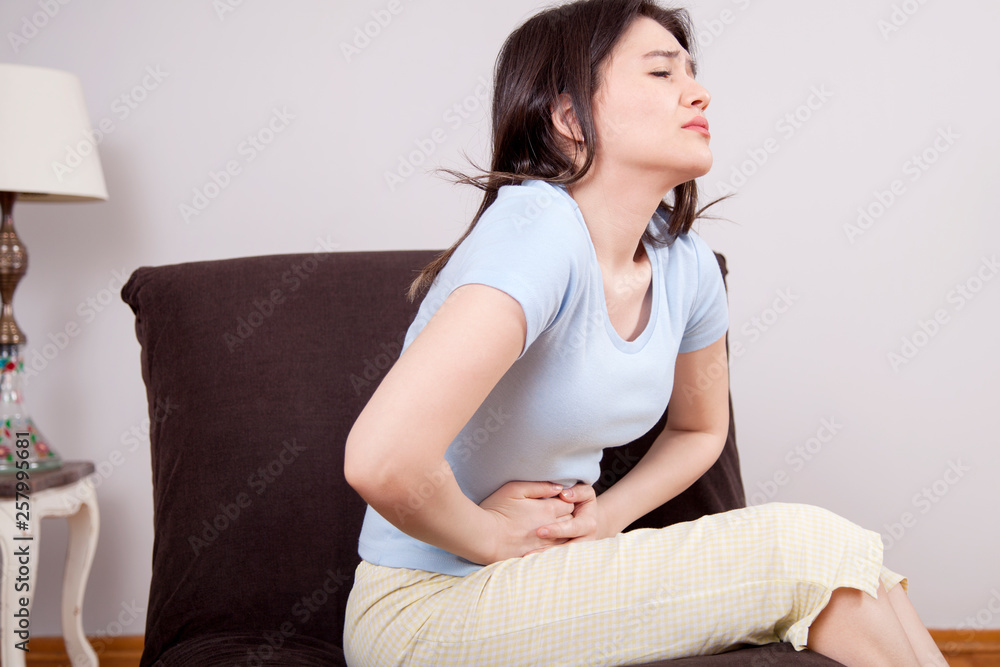 Young woman with stomach pain Young woman with stomach pain