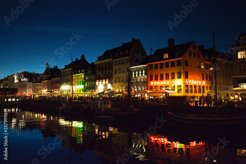 Copenhagen, Denmark-2 August, 2018: Famous Nyhavn (New Harbour) bay in Copenhagen, a historic 17 century European waterfront with colorful buildings. A starting point for boat and canal tours.
