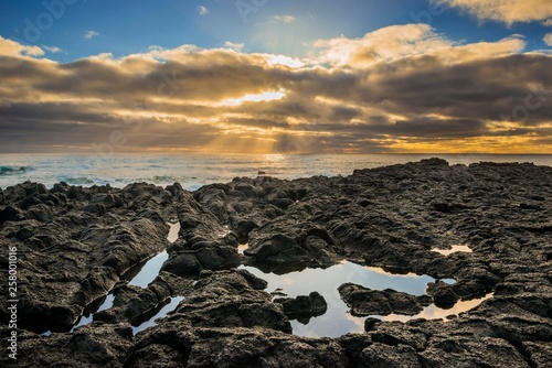 Lava coast at sunset with dark clouds, near Malarrif, peninsula Snaefellsnes, Vesturland, Iceland, Europe