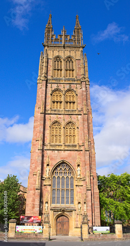 St Mary anglican church front tower and entrance, Taunton, Somerset, England, UK, bright summer morning with blue sky and some white clouds