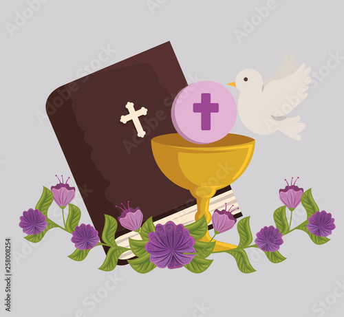 bible and chalice with holy host to first communion