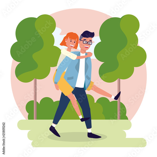 nice man carrying on his back a pretty woman