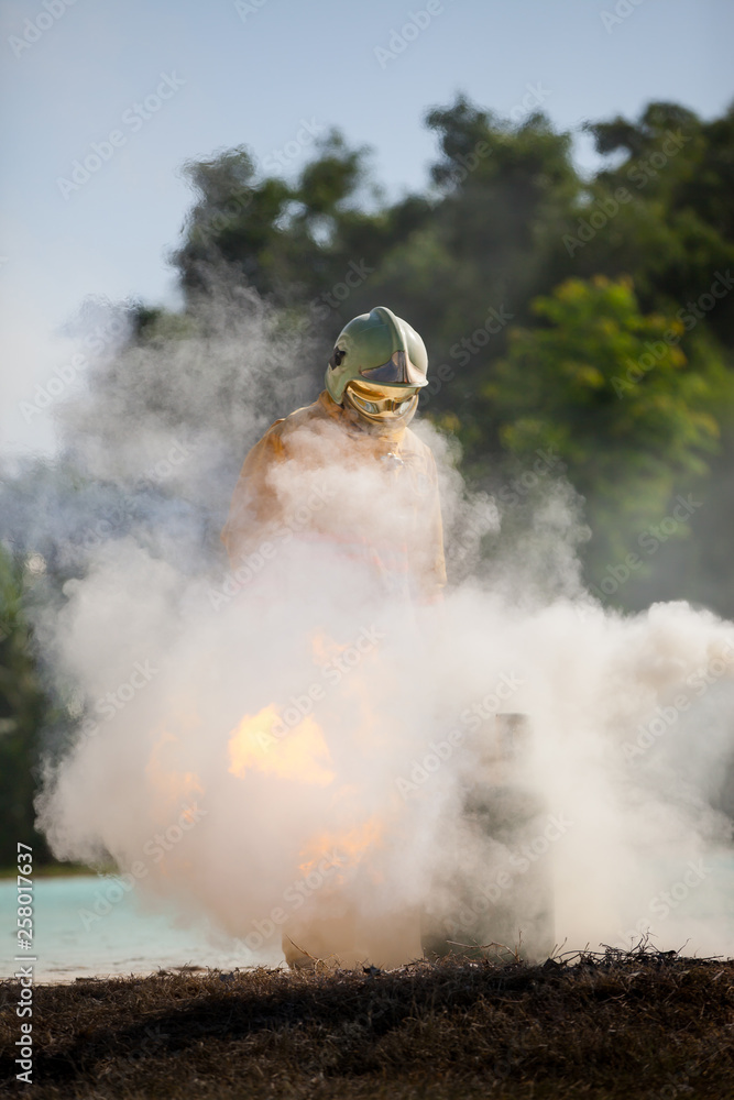 Obraz premium Firefighter with fire and suit for protect fire fighter for training firefighters.