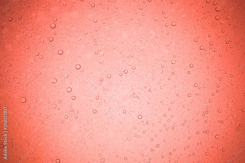 Rain droplets on red glass background, Water drops on glass. Rain droplets on red glass background, Water drops on glass.