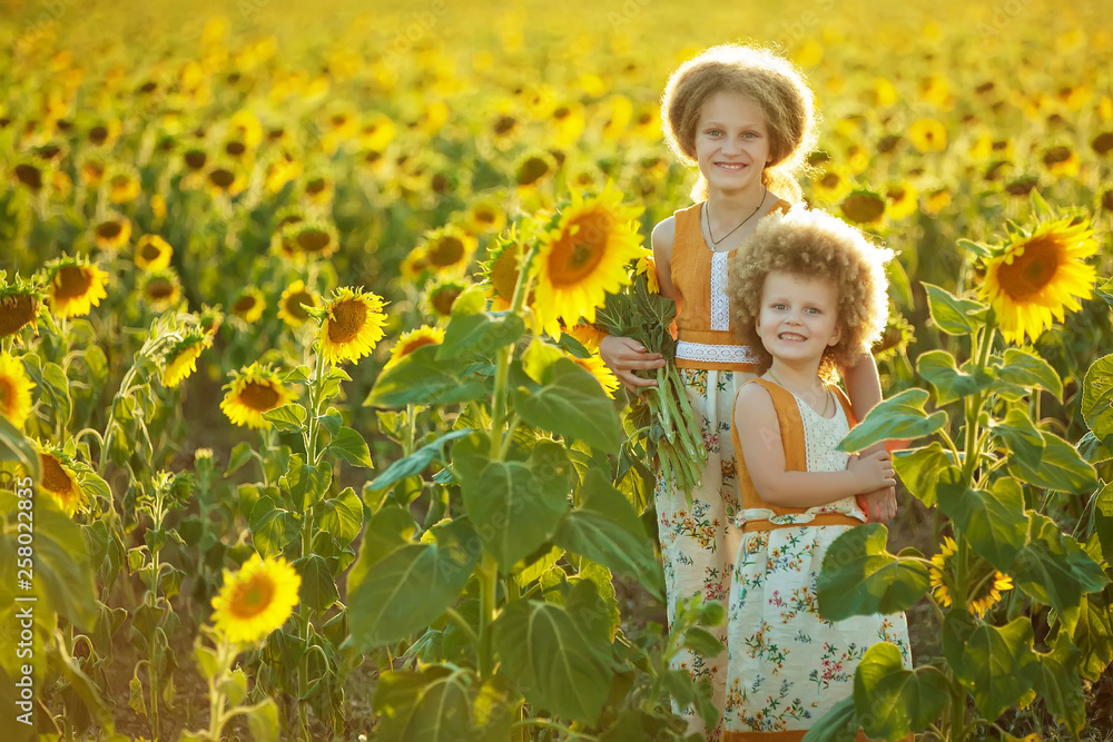 Children in sunflowers Children in sunflowers