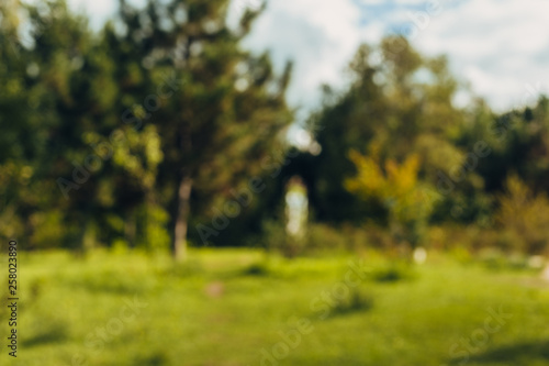 Abstract blur beautiful landscape city park bokeh background with sunlight in daytime.