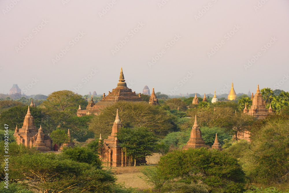 Stunning view of the beautiful Bagan ancient city (formerly Pagan) during sunset. The Bagan Archaeological Zone is a main attraction in Myanmar and over 2,200 temples and pagodas still survive today. Stunning view of the beautiful Bagan ancient city (formerly Pagan) during sunset. The Bagan Archaeological Zone is a main attraction in Myanmar and over 2,200 temples and pagodas still survive today.