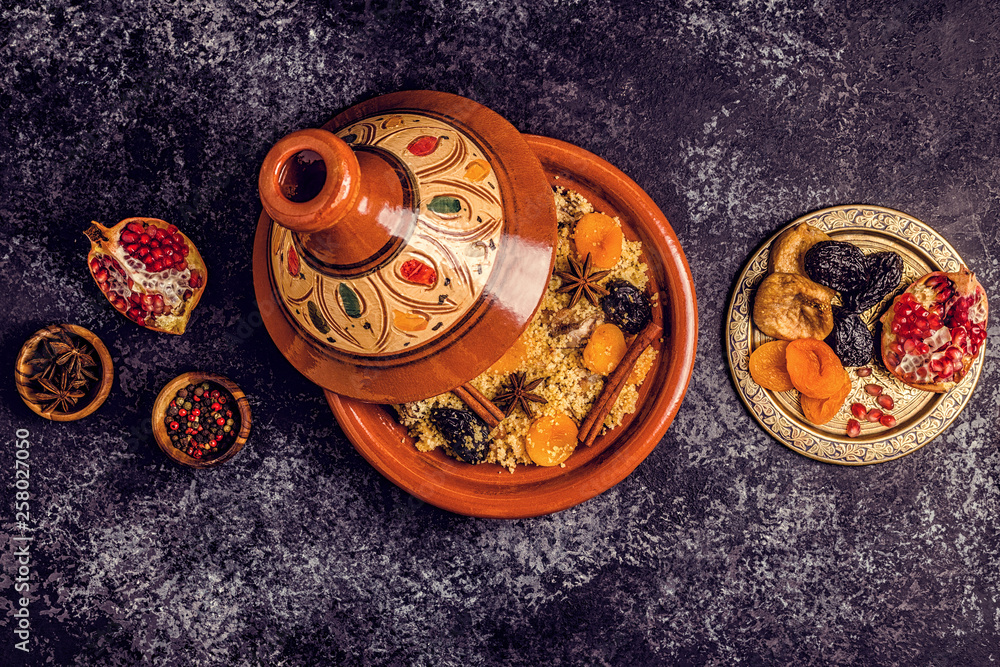 Traditional moroccan tajine of chicken with dried fruits and spices.