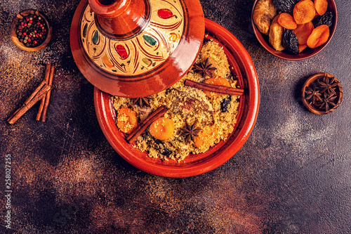 Traditional moroccan tajine of chicken with dried fruits and spices.