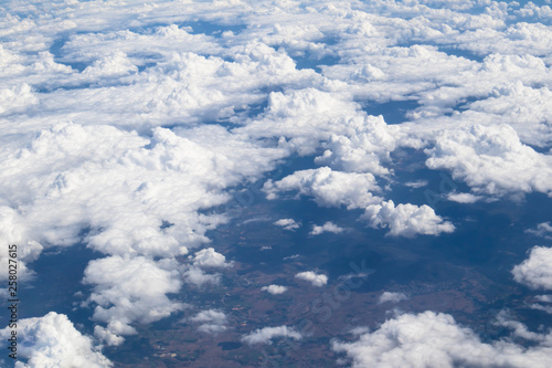 Dramatic atmosphere Aerial view of nature cloudscape show  freshness white soft clouds view background from aircraft. © ekapolsira