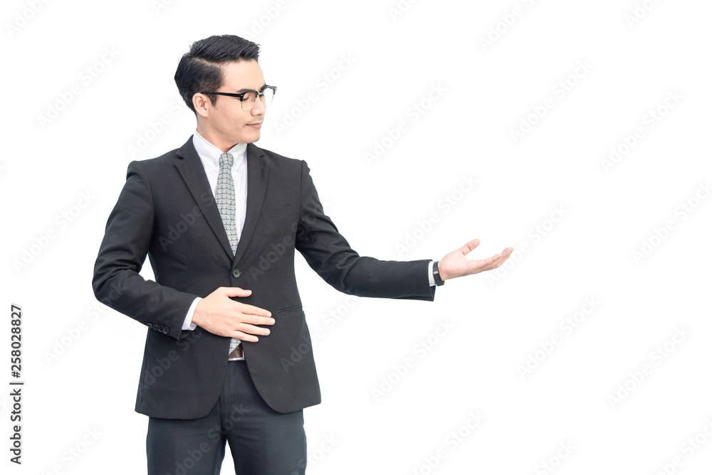 Happy young confident asian businessman with eyes glasses in formal black suit showing hand blank area for advertisement, sign, text, slogan .with copy space, isolated on pure white background Happy young confident asian businessman with eyes glasses in formal black suit showing hand blank area for advertisement, sign, text, slogan .with copy space, isolated on pure white background