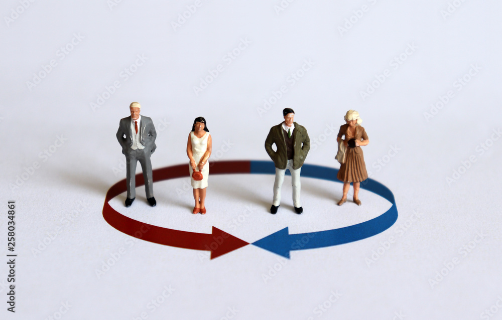 Miniature people. The concept of equality between men and women in a group. Miniature people. The concept of equality between men and women in a group.