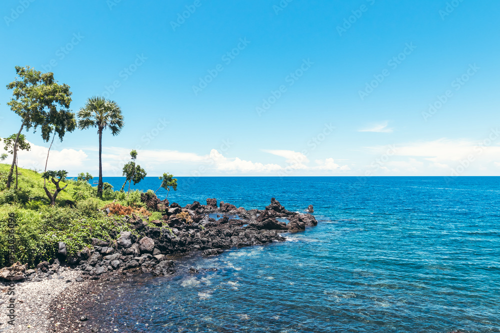 Dream island. Wild tropical beach with rocks and contrast blue sky. Bali island. Dream island. Wild tropical beach with rocks and contrast blue sky. Bali island.