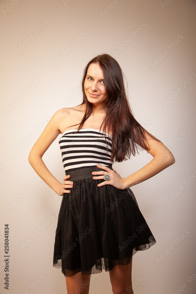 Beautiful brunette girl posing for photo at the studio Beautiful brunette girl posing for photo at the studio
