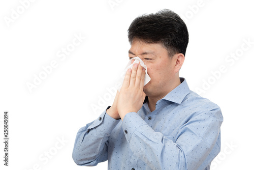 A middle-aged man suffering from rhinitis on white background.