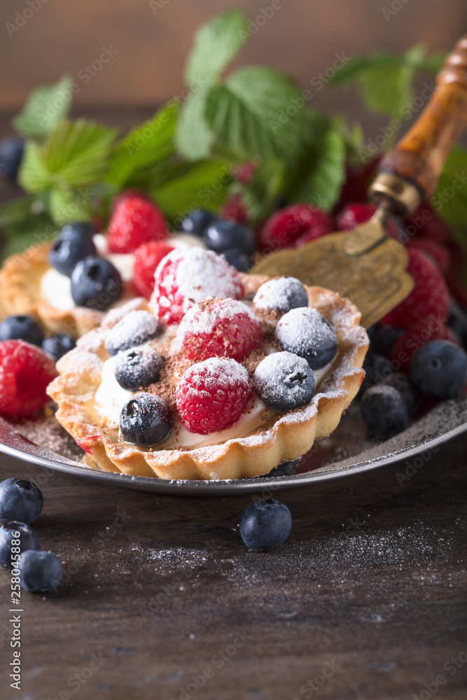 Dessert tarts with raspberries and blueberries. Dessert tarts with raspberries and blueberries.