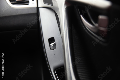 Close up of inside modern car door opener 