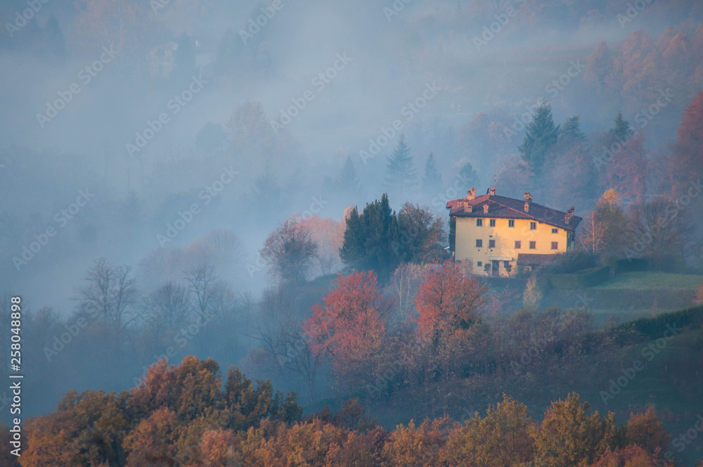 Beautiful foggy sunrise in Tuscany, Italy, italian villa