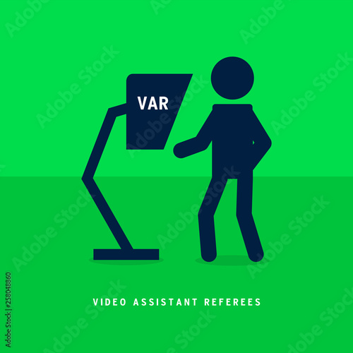 Football referee watch replay video on var.