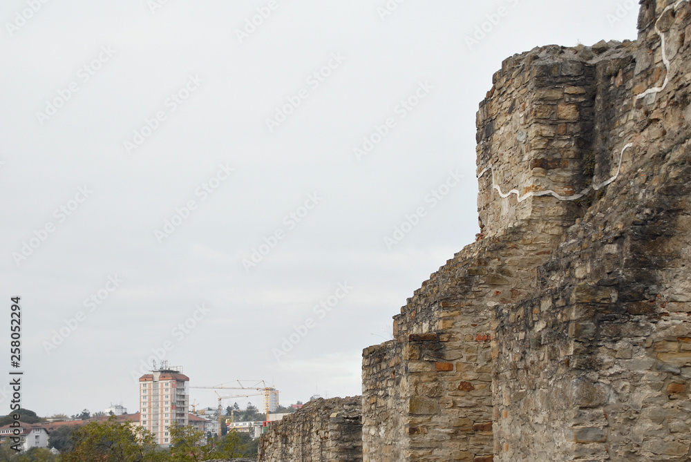 An old medieval fortress. Restoration of the walls of the fortress, excavation.