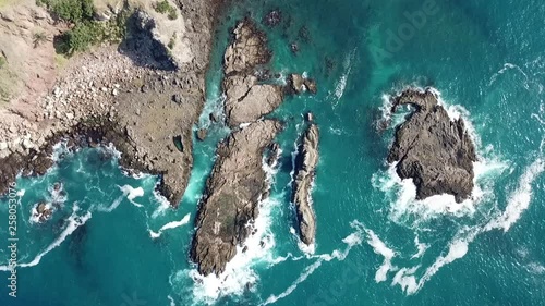 Aerial shot, drone view looking above rotating, waves hitting the rocks
Medlands beach, Great Barrier Island, New Zealand photo