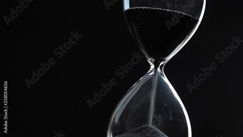 Hourglass on dark background