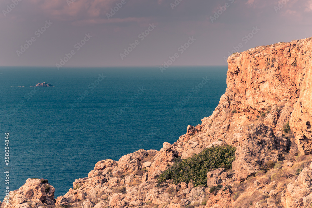 Greek seaside with cliffs