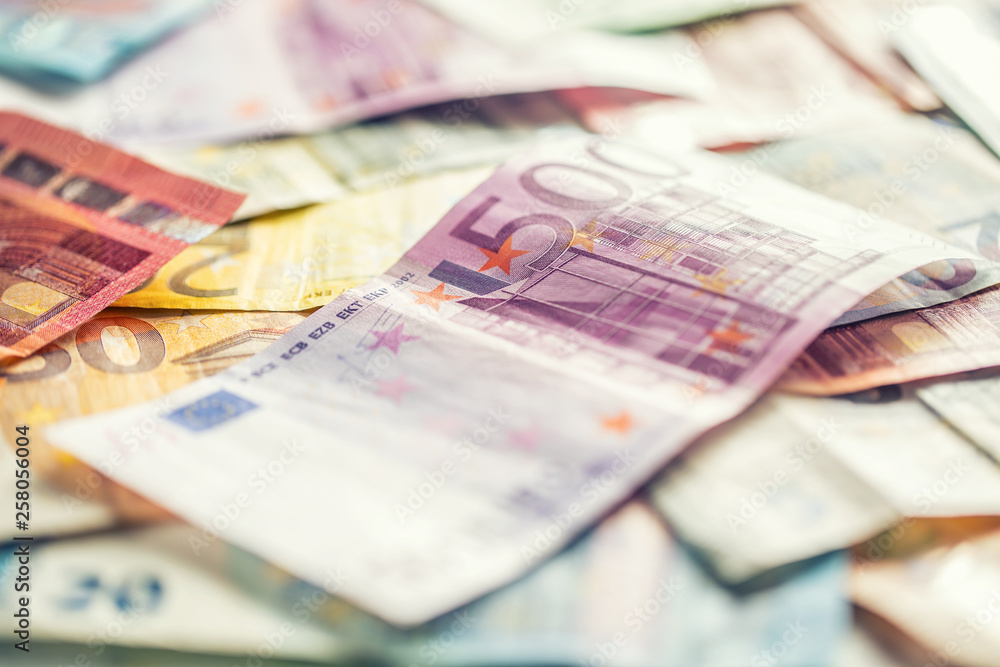 Several hundred euro banknotes stacked by value Several hundred euro banknotes stacked by value