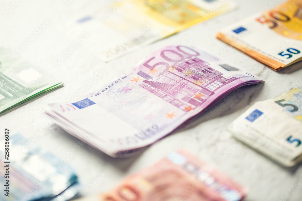 Several hundred euro banknotes stacked by value Several hundred euro banknotes stacked by value