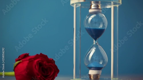 Hourglass on blue background