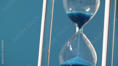 Hourglass on blue background