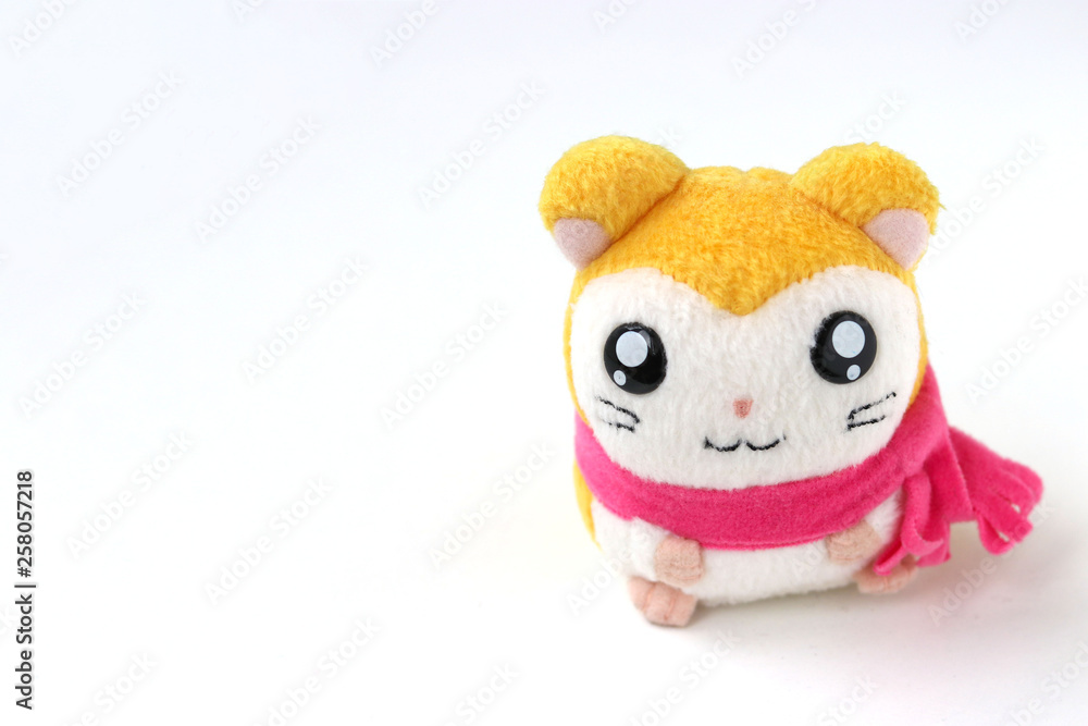 Children's soft toy mouse in a pink scarf is located on a white background Children's soft toy mouse in a pink scarf is located on a white background