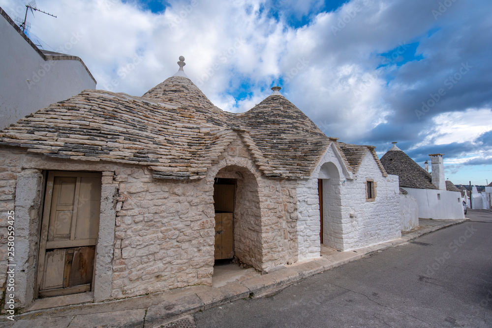 View of Alberobello's famous Trulli, the characteristic cone-roofed white houses of the Itria Valley, Apulia, Southern Italy. ALBEROBELLO, PUGLIA, ITALY