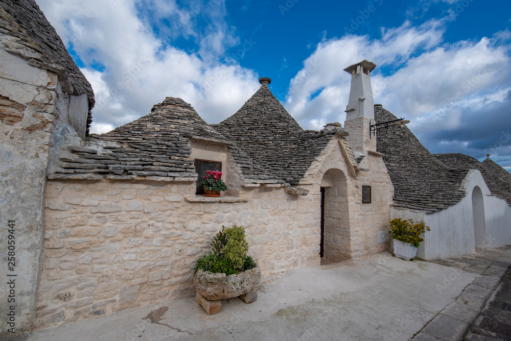 View of Alberobello's famous Trulli, the characteristic cone-roofed white houses of the Itria Valley, Apulia, Southern Italy. ALBEROBELLO, PUGLIA, ITALY
