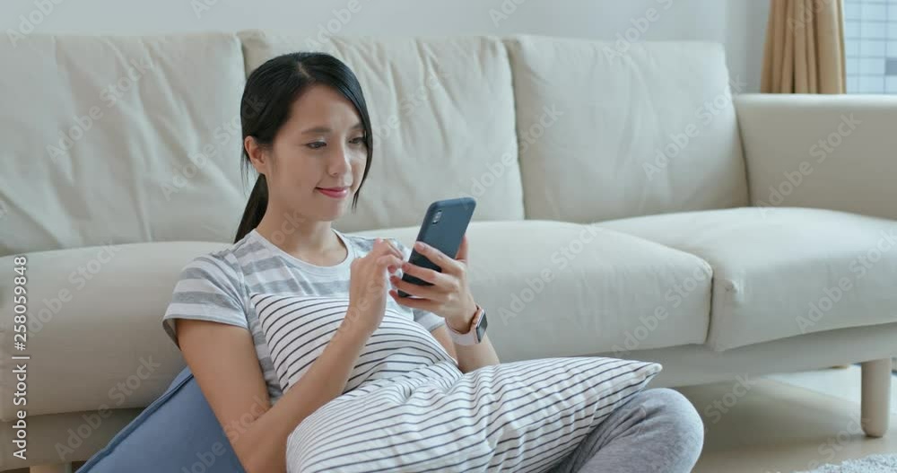 Woman use of mobile phone at home Woman use of mobile phone at home