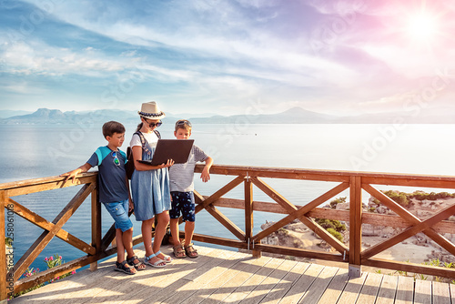 Young bloggers on the beach. Picturesque places of Greece.