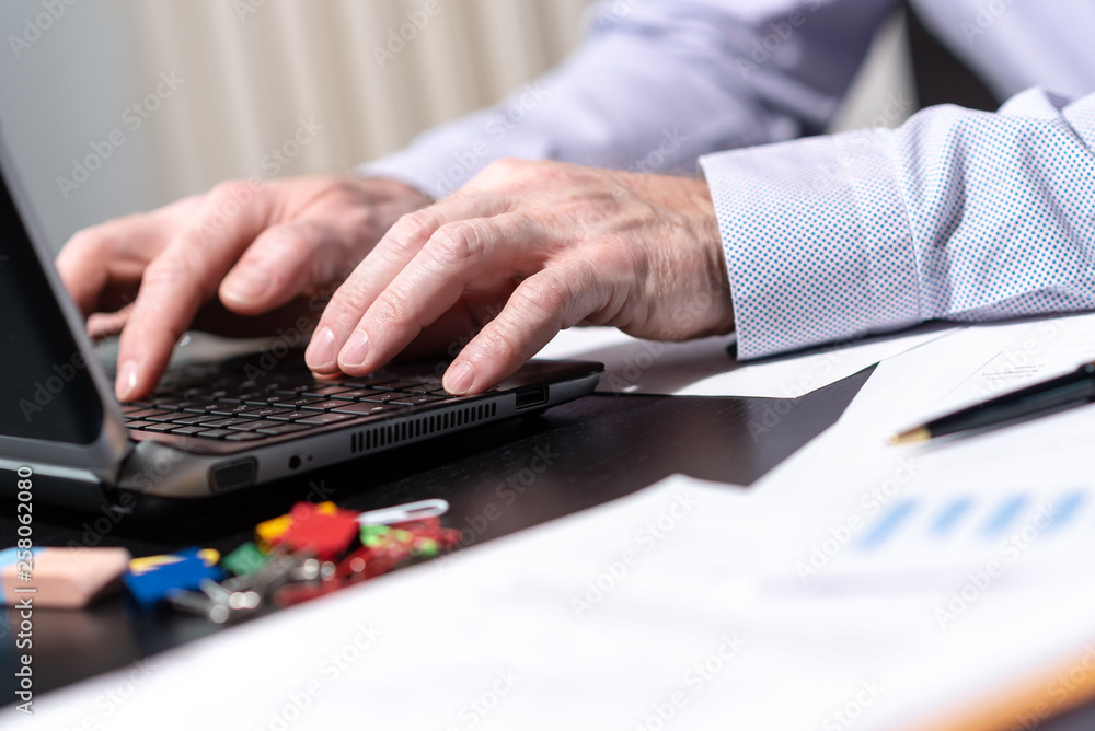 Hands of businessman using laptop, light effect Hands of businessman using laptop, light effect