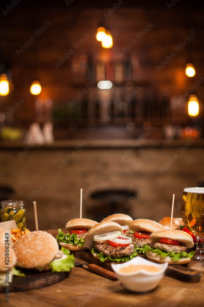 Delicious burgers and cheesburgers on a table