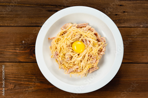 noodles with bacon, fried egg