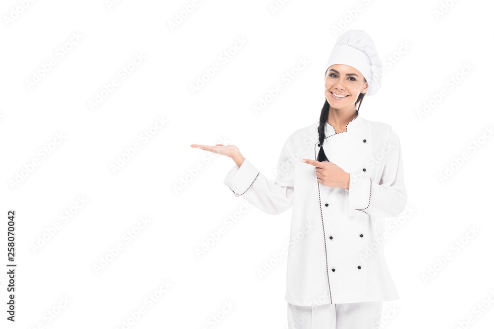 Cheerful smiling chef in hat gesturing isolated on white Cheerful smiling chef in hat gesturing isolated on white